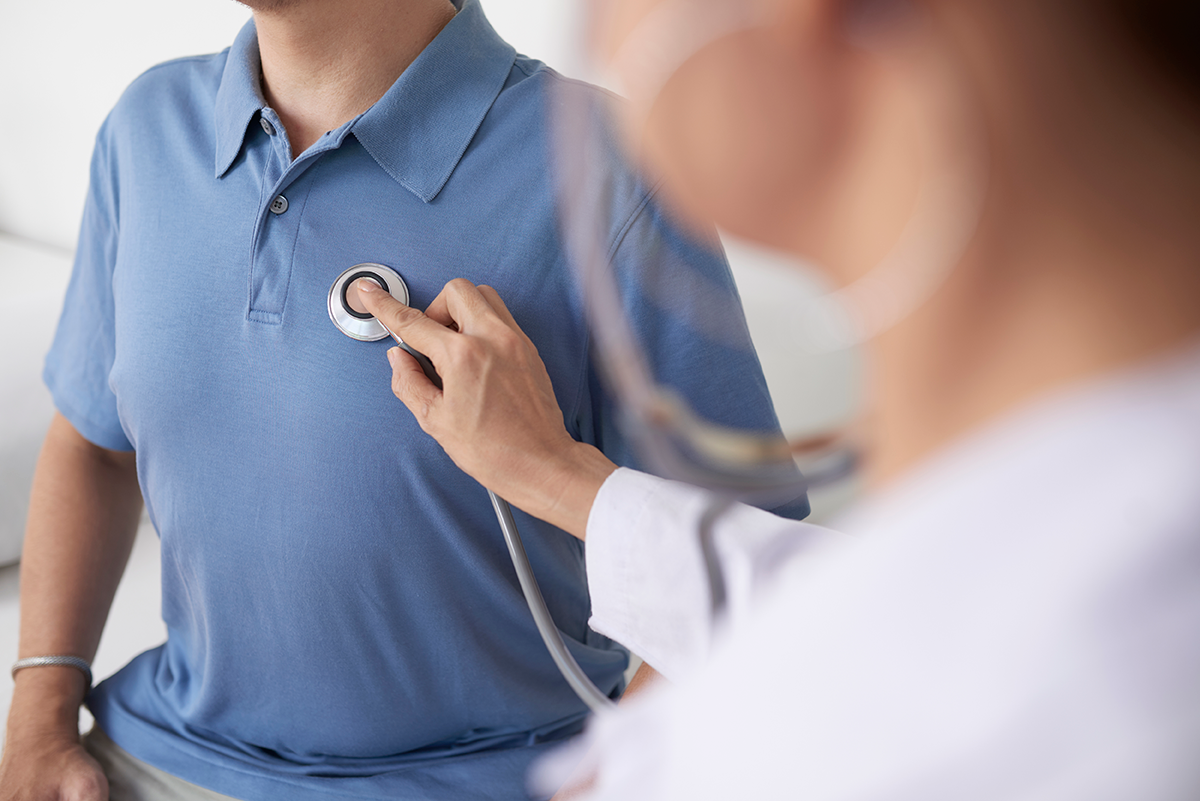 Physician listening to a patient's heartbeat with a stethoscope